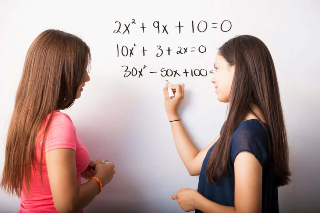 high school students during academic coaching solving equations